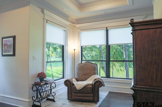 sitting room featuring crown molding, plenty of natural light, and light hardwood / wood-style floors