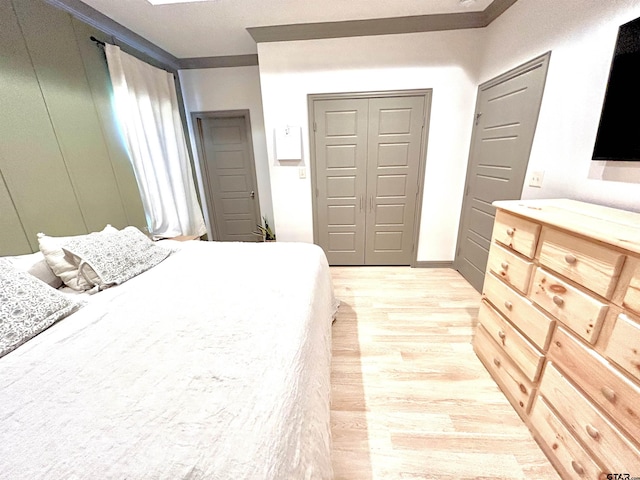 bedroom with light wood-type flooring