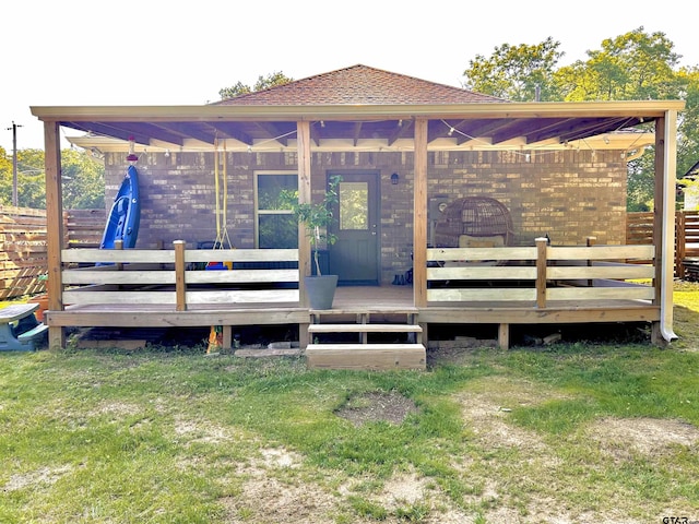 wooden deck featuring a yard