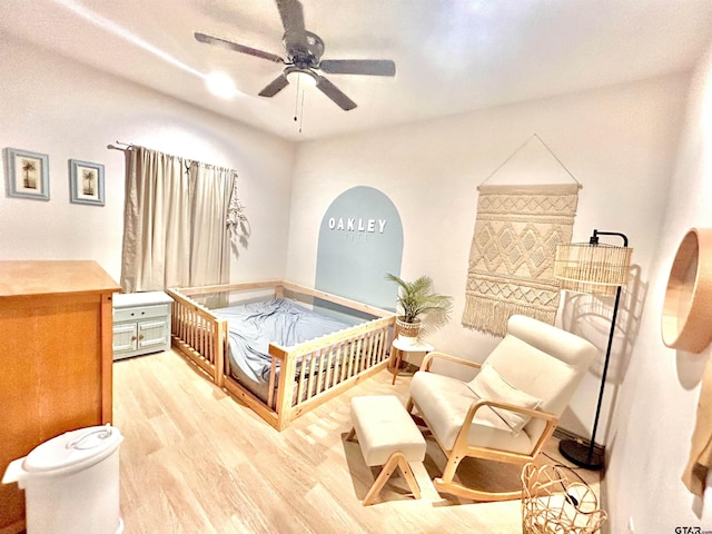 bedroom with ceiling fan and light hardwood / wood-style flooring