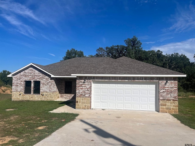 single story home with a garage and a front yard