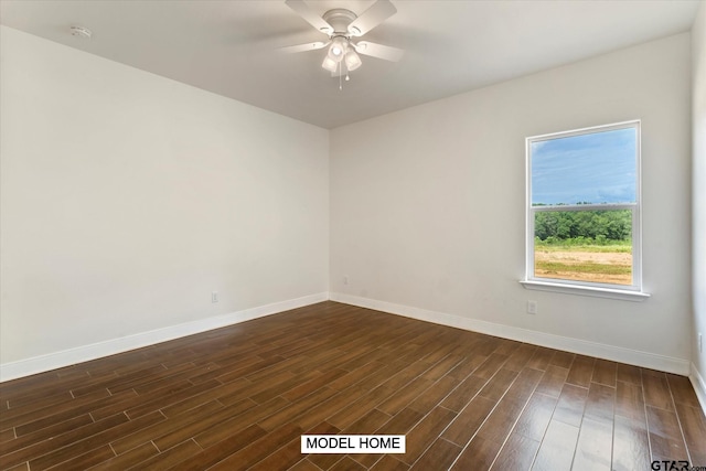 unfurnished room with dark hardwood / wood-style flooring and ceiling fan