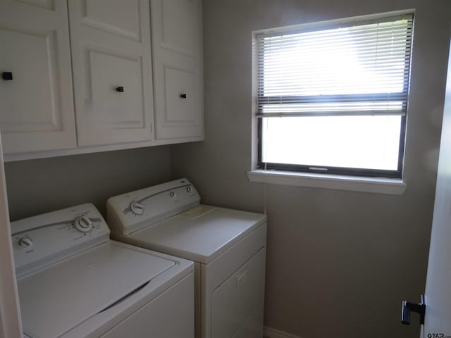 1418 Kenny Dr, Mineola, TX 75773 - laundry room featuring washing machine and clothes dryer and cabinet space