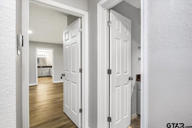 hall featuring dark wood-type flooring