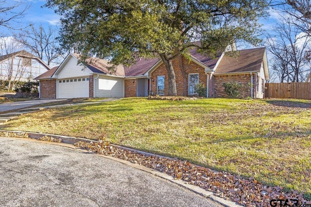 ranch-style house with a front yard and a garage