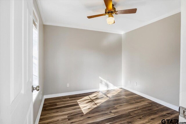 spare room with ceiling fan, dark hardwood / wood-style flooring, and ornamental molding