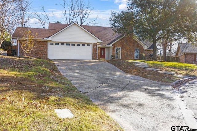 ranch-style home featuring a garage