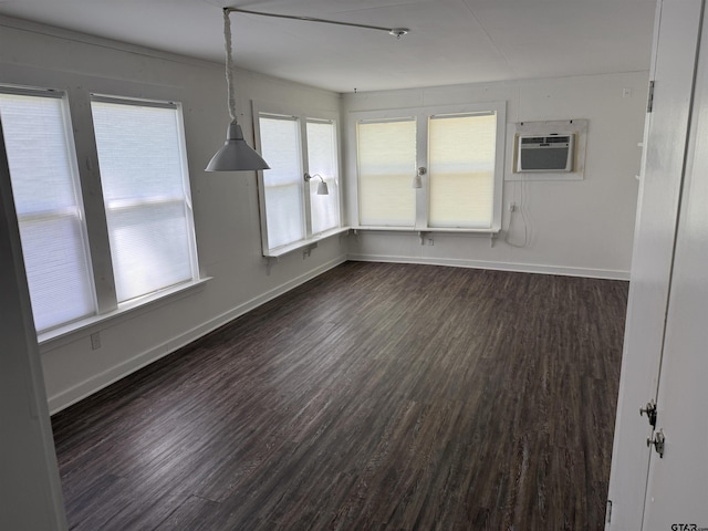 2595 Fm 1857 S, Rusk, TX 75785 - unfurnished dining area with a wall mounted AC and dark wood-style floors