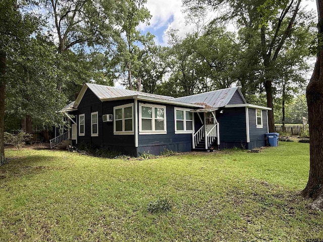 2595 Fm 1857 S, Rusk, TX 75785 - view of front of home with a front lawn, entry steps, and a metal roof