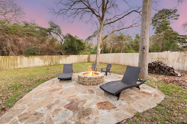 view of patio with an outdoor fire pit and a fenced backyard