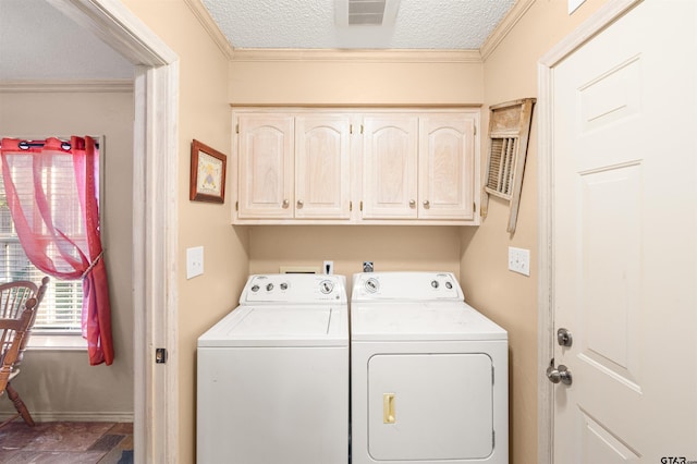 laundry room with crown molding, visible vents, cabinet space, a textured ceiling, and independent washer and dryer