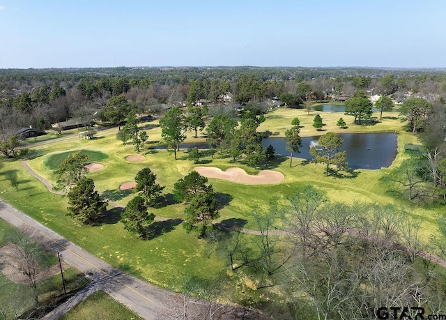 bird's eye view with view of golf course and a water view