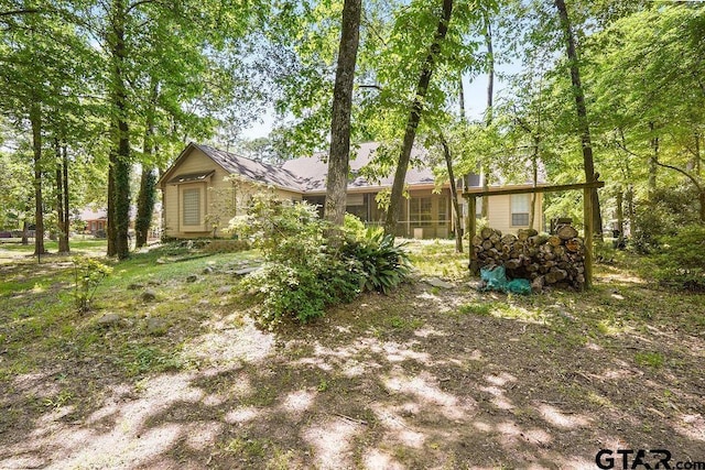 view of yard with a sunroom