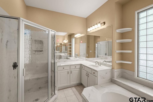 full bath with a bath, tile patterned floors, vanity, and a stall shower