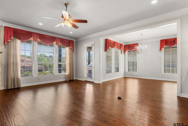 empty room featuring ceiling fan with notable chandelier, wood finished floors, and ornamental molding