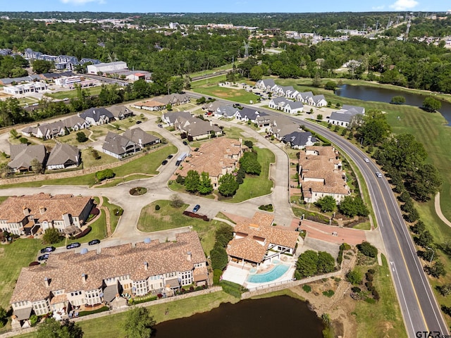 birds eye view of property featuring a water view and a residential view