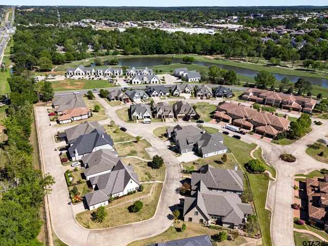 bird's eye view featuring a water view and a residential view