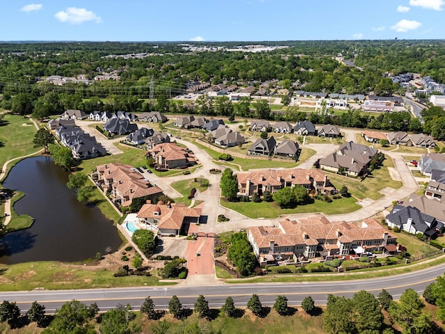 birds eye view of property with a water view and a residential view
