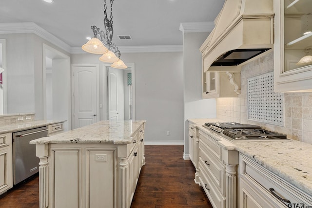 kitchen featuring custom exhaust hood, ornamental molding, cream cabinetry, visible vents, and stainless steel appliances