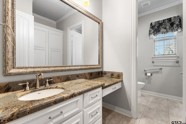 bathroom featuring crown molding, vanity, visible vents, toilet, and baseboards