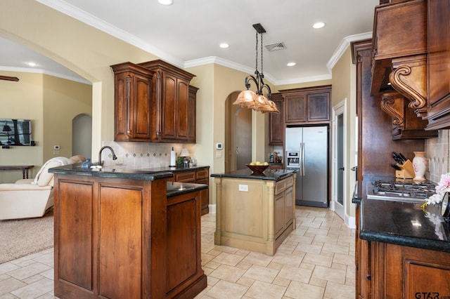 kitchen with a center island, backsplash, stainless steel refrigerator with ice dispenser, ornamental molding, and kitchen peninsula