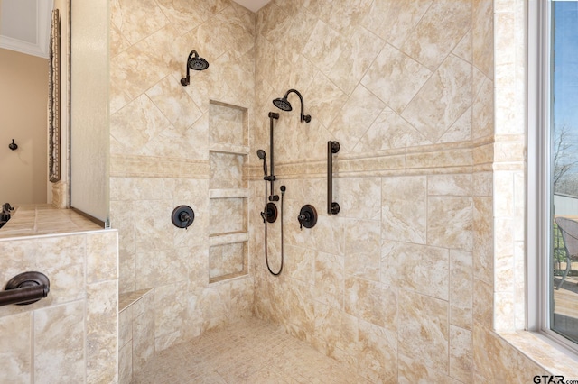 bathroom with a tile shower