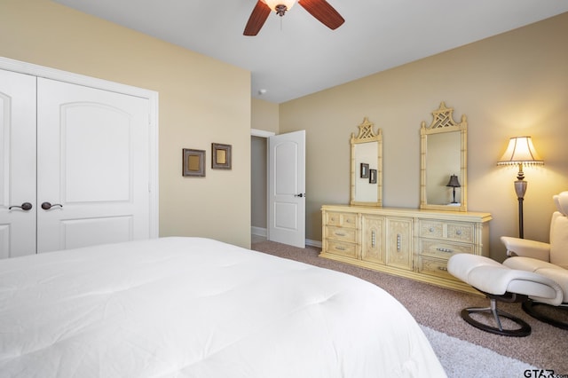 bedroom with ceiling fan, a closet, and carpet