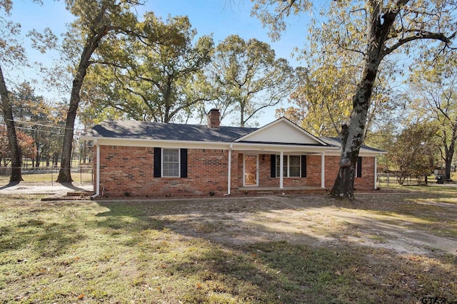 ranch-style home with a front lawn