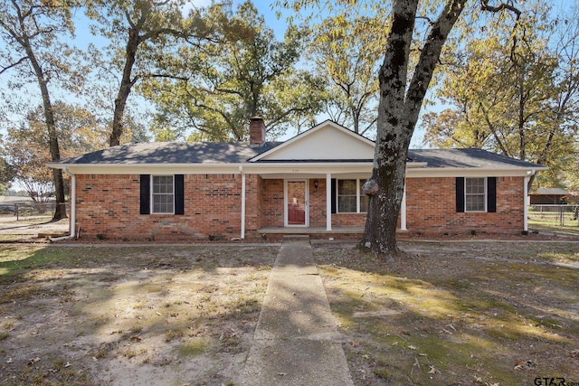 single story home with a porch