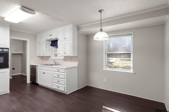 kitchen featuring sink, hanging light fixtures, black oven, dark hardwood / wood-style flooring, and white cabinetry