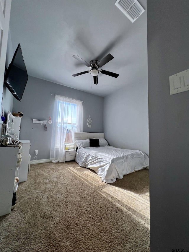 bedroom featuring ceiling fan and carpet floors