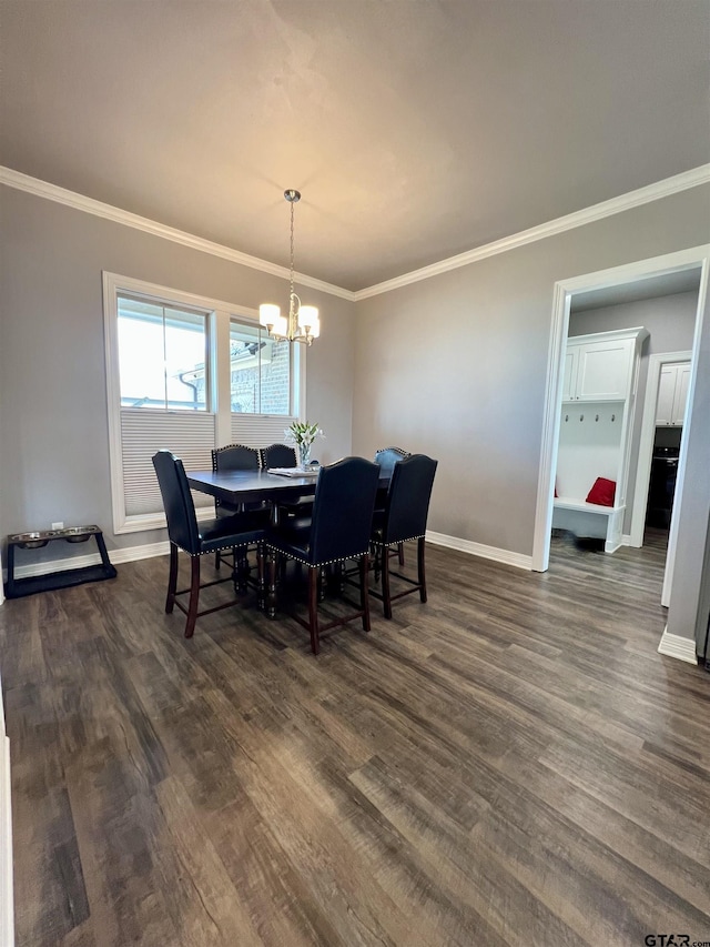 dining space with an inviting chandelier, ornamental molding, and dark hardwood / wood-style floors