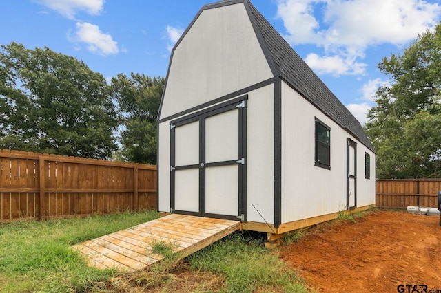 view of shed with a fenced backyard