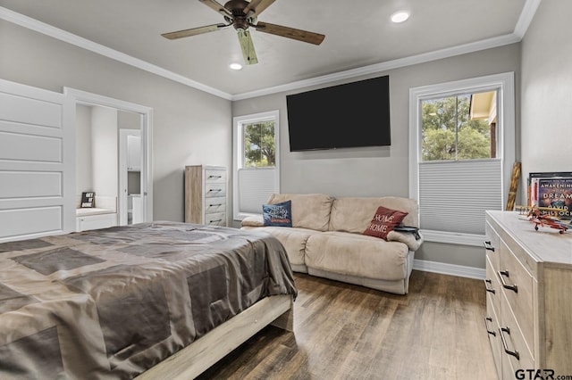 bedroom with multiple windows, ornamental molding, and dark hardwood / wood-style flooring