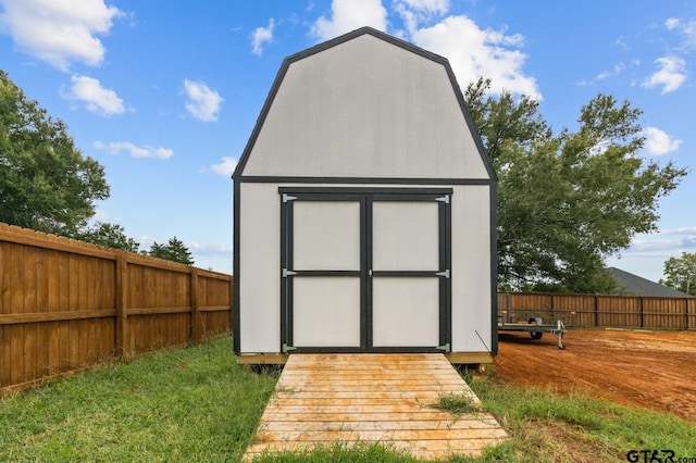 view of shed featuring a fenced backyard