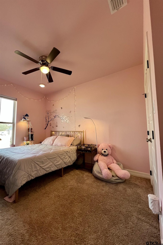 unfurnished bedroom with carpet floors, ceiling fan, and visible vents