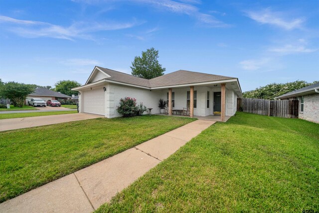 7032 La Hacienda Dr, Flint, TX 75762 - ranch-style house featuring concrete driveway, an attached garage, covered porch, and brick siding