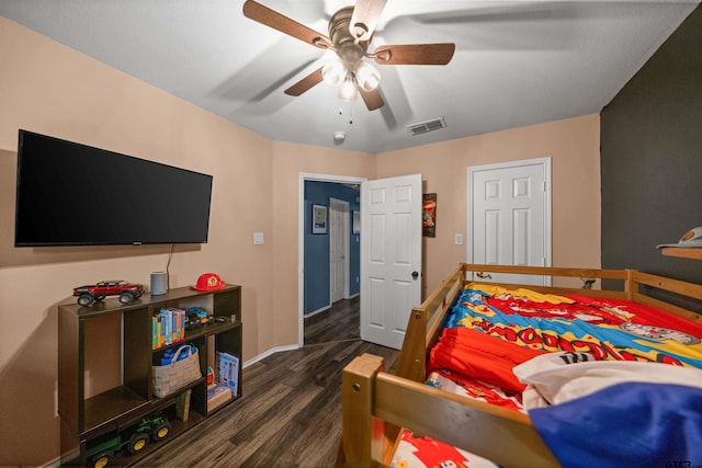 7032 La Hacienda Dr, Flint, TX 75762 - bedroom with baseboards, dark wood-style floors, and ceiling fan