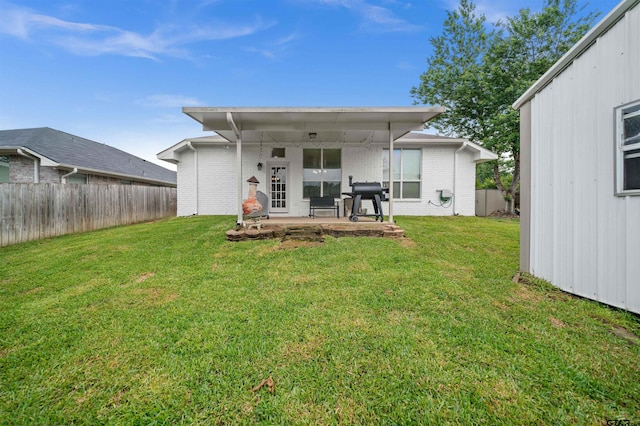 7032 La Hacienda Dr, Flint, TX 75762 - back of house featuring a patio and brick siding