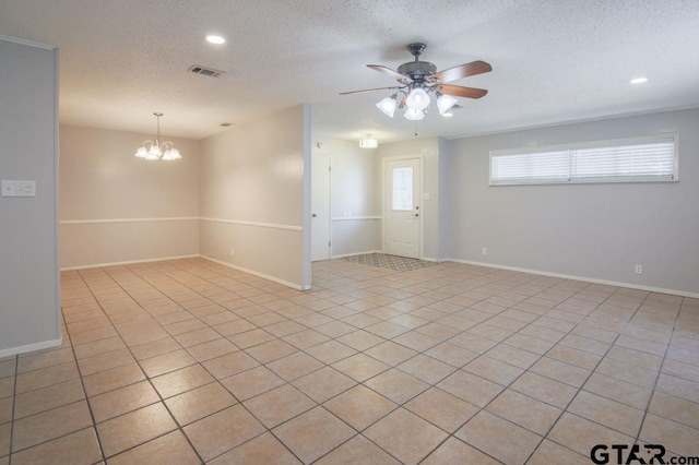 12595 Oneall St, Tyler, TX 75704 - unfurnished room with ceiling fan, a textured ceiling, recessed lighting, light tile patterned floors, and a chandelier