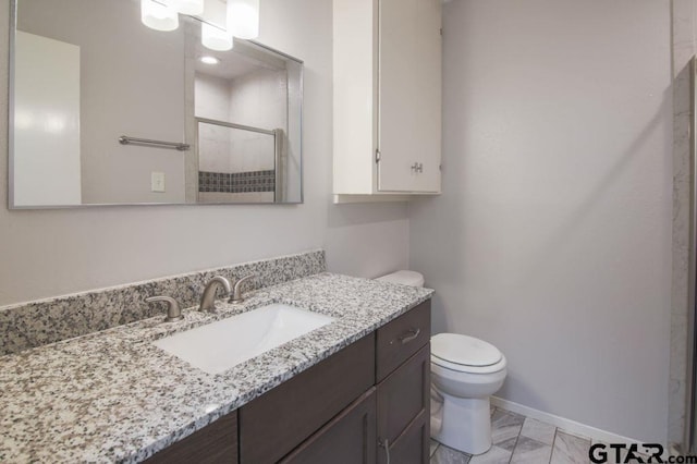 12595 Oneall St, Tyler, TX 75704 - bathroom featuring a shower stall, toilet, vanity, baseboards, and marble look tiles