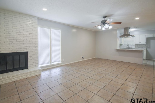 12595 Oneall St, Tyler, TX 75704 - unfurnished living room featuring a ceiling fan, light tile patterned floors, healthy amount of natural light, a textured ceiling, and recessed lighting