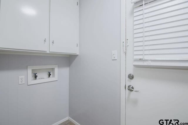 12595 Oneall St, Tyler, TX 75704 - clothes washing area featuring hookup for a washing machine and cabinet space