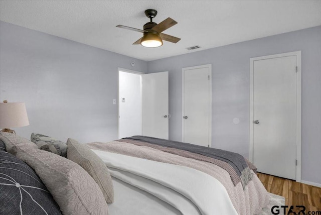 12595 Oneall St, Tyler, TX 75704 - bedroom featuring light wood finished floors and ceiling fan