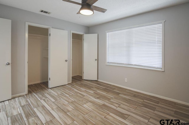12595 Oneall St, Tyler, TX 75704 - unfurnished bedroom with light wood-style flooring, baseboards, and a ceiling fan