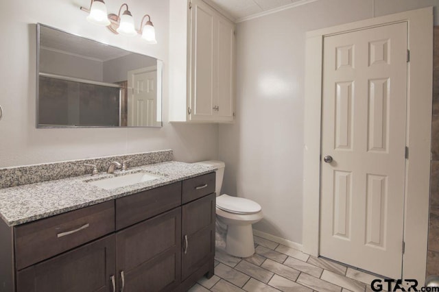 12595 Oneall St, Tyler, TX 75704 - bathroom featuring crown molding, a stall shower, toilet, vanity, and baseboards