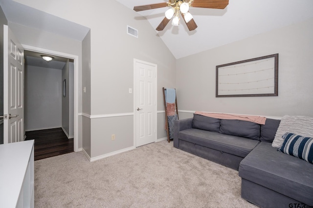 carpeted living room with lofted ceiling and ceiling fan