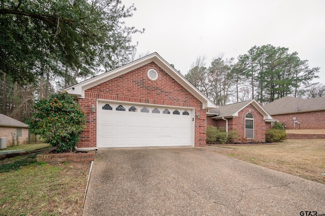 single story home featuring a garage, central AC unit, and a front lawn