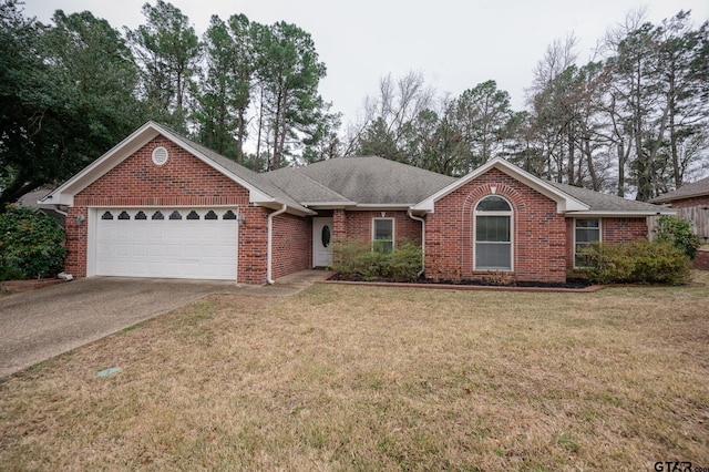 ranch-style home featuring a garage and a front yard