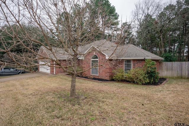 view of front facade with a garage and a front lawn